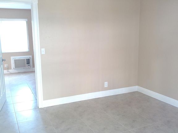 Bedroom, New tile and big enough for a queen bed with furnit