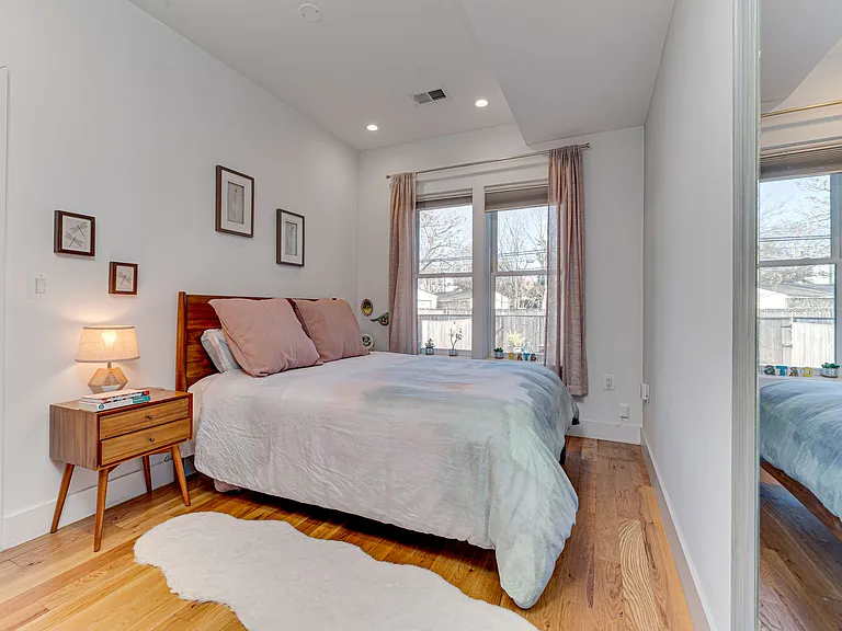 Master bedroom with en-suite bathroom and outdoor access.