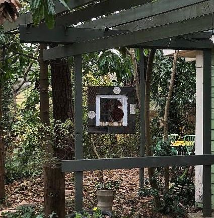 Planters and Hanging Art at Entry w/view to Back Patio
