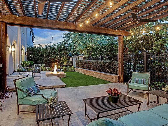 The amazing yard was professionally landscaped and features a water feature, fire pit, amazing pergola and sitting area, flower beds with astroturf. Designed for a future pool install, this checks every box!