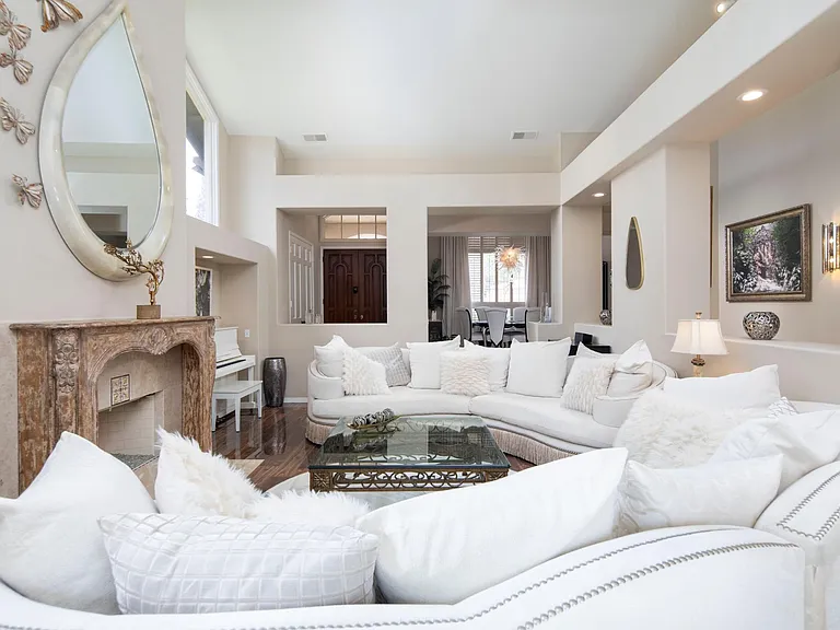 Large family room area great for relaxing or entertaining. 2 sofas, porcelain flooring