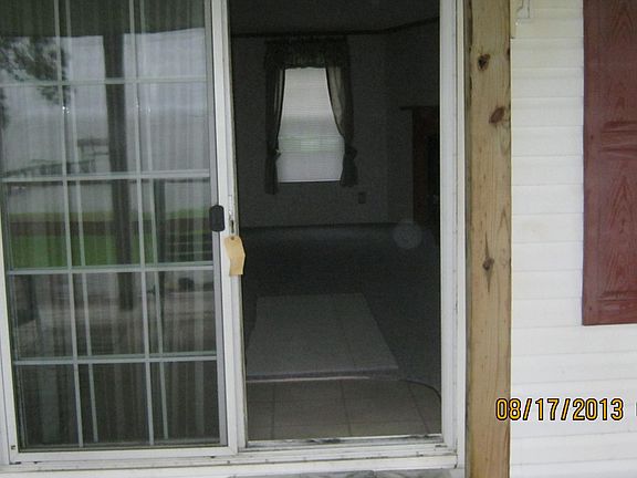 entrance through rear of house view of livingroom/den area