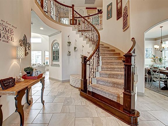 Open the front door and WOW, notice the high ceilings and this amazing staircase.