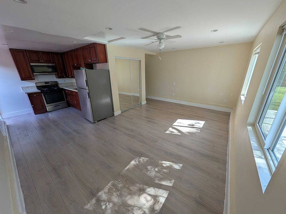 Living area with ceiling fan and mini-split AC