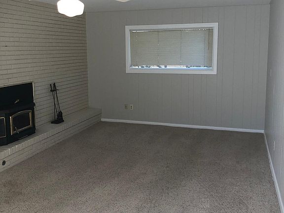 Family room with wood fireplace.