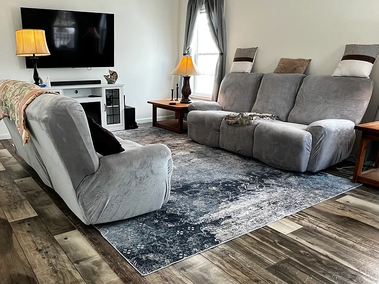 Living room view, smart tv and electric fireplace.
