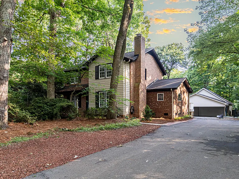 2-car driveway, plus an extra parking pad.