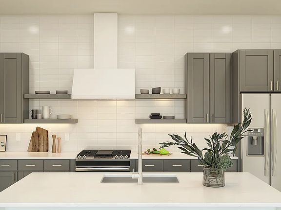 Kitchen with island and subway tile backsplash