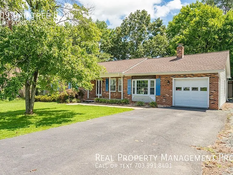 209 Raintree Blvd — Photo 1
