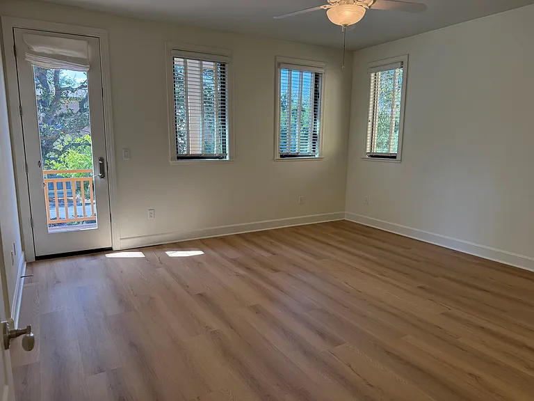 Primary bedroom has a patio door that opens a balcony overlooking the community green belt. Primary bedroom features 2 walk-in closets with tastefully appointed in-suite bathroom with 2 sinks, a whirlpool bathtub and a shower stall with glass enclosure.