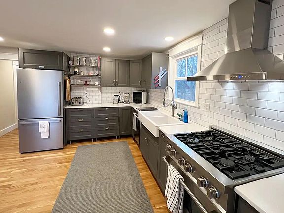 Newly renovated spacious kitchen that opens into the dining and living room space.