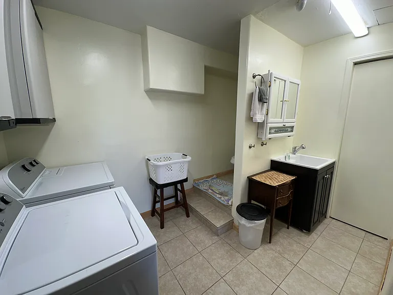 Laundry area and basement bathroom