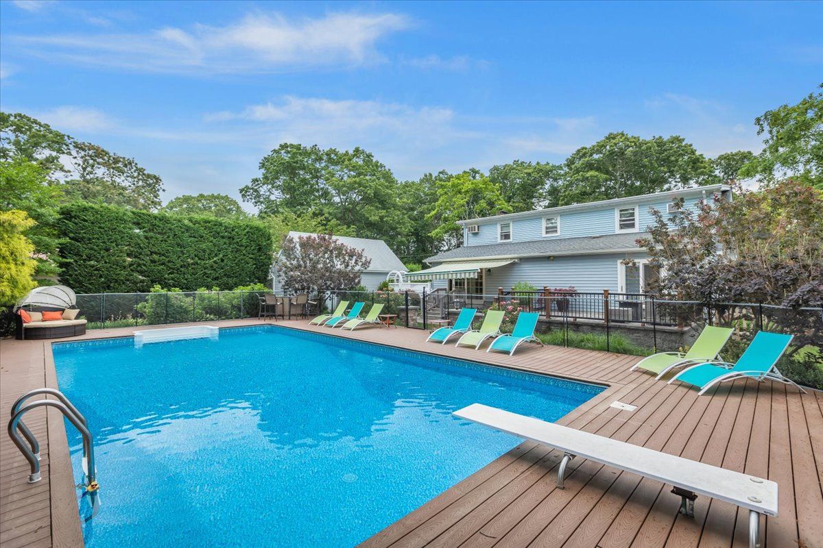  In-Ground Saltwater Swimming Pool with Resort-Style Surround Deck and Patios.