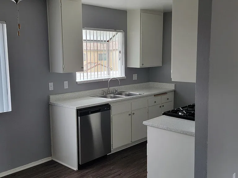 Kitchen and dining room area at Grand Oaks Apartments in Lake Elsinore, California.