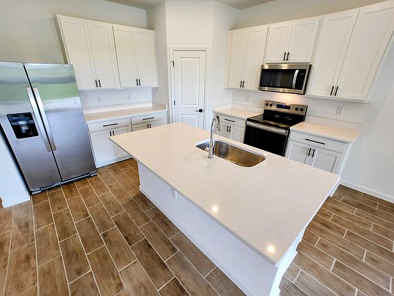 Kitchen with all new appliance (fridge with ice maker, garbage disposal, stove, microwave) and large pantry.