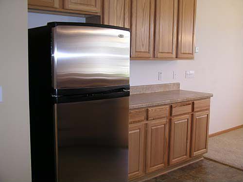 Kitchen has stainless whirlpool appliances