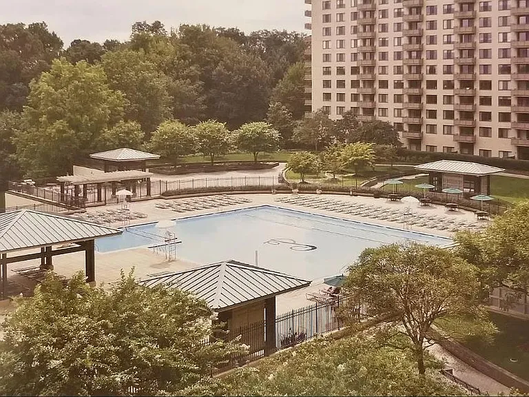 Relax at this gorgeous outdoor swimming pool with expansive, landscaped sun deck!