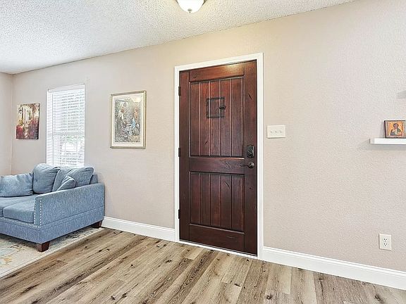 Entrance- new designer plank tile in living room, dining room, and kitchen area.