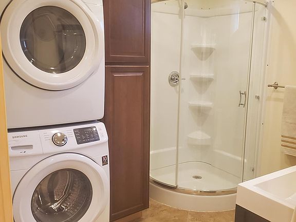 Unit has own laundry with new appliances. New shower and storage.