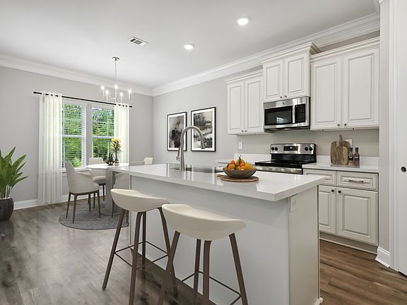Kitchen in the Sandpiper floorplan at a Meritage Homes community in Gulfport, MS.