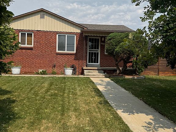 Beautiful professionally landscaped yard with mature trees.