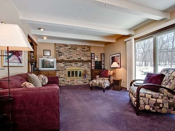 The family room is accented by a wood burning fireplace for those cold nights.