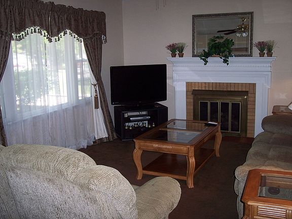 Living room has gas fireplace