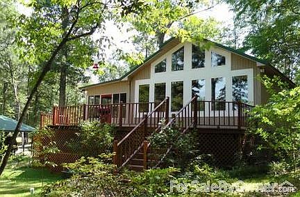 Lake View
						:
						View of home facing the lake. Beautiful view from the deck & all those windows!