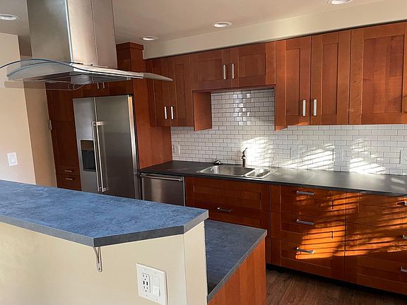 Kitchen with gas range, dishwasher, stainless appliances