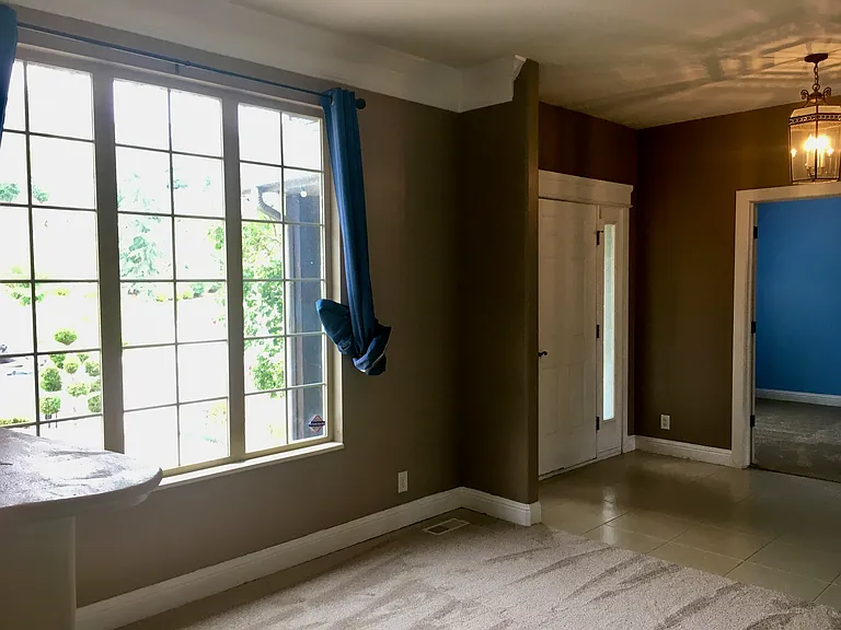 Parlor or sitting room with brand new carpet installed.