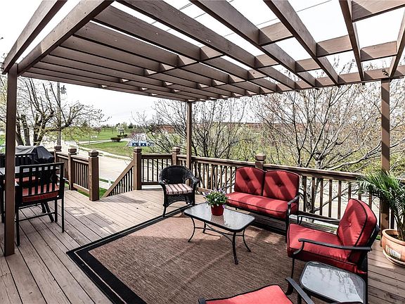 Large deck with pergola and open grilling area extends the living and entertaining area outdoors