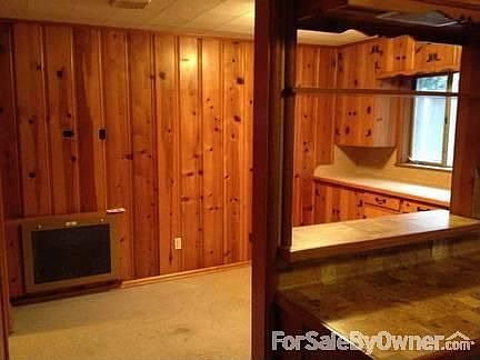 Breakfast Room
						:
						Pine paneling and storage cabinets with pass through to kitchen