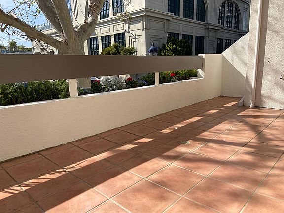 Main balcony with exterior storage and hose bibb