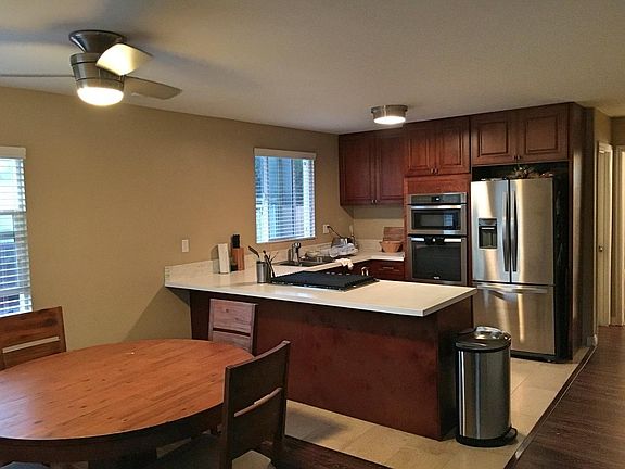dining kitchen area and hallway to bedrooms and bathroom