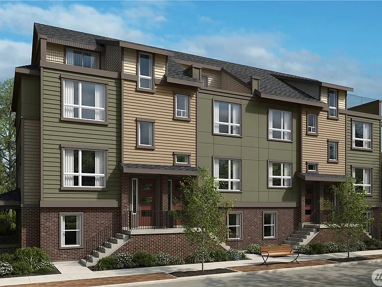 Modern townhome in the desirable Issaquah Highlands community with attractive architecture, professionally maintained landscaping, and a welcoming neighborhood setting.