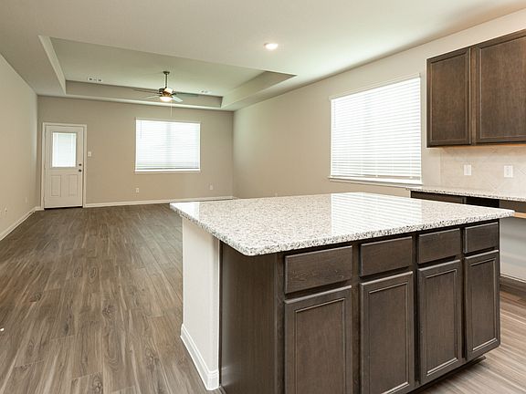 Kitchen to Dining Area and Family Room