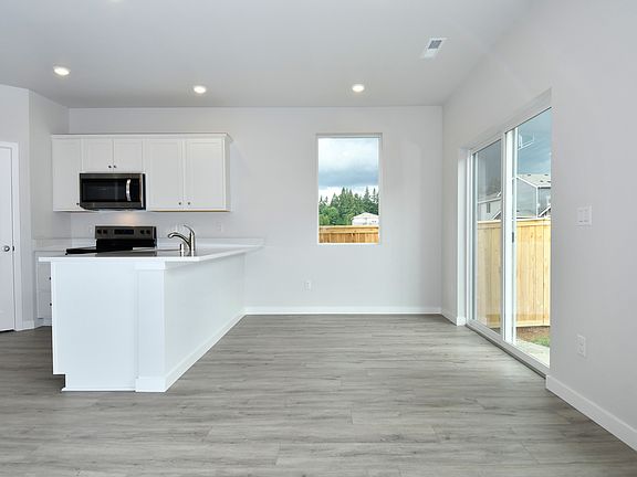 The kitchen seamlessly connects to the spacious dining area.
