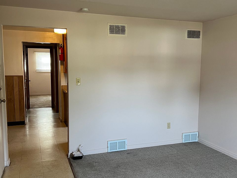 Living room, kitchen and way to bedroom