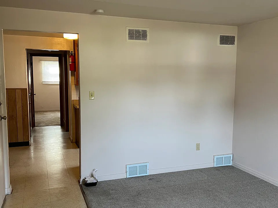 Living room, kitchen and way to bedroom