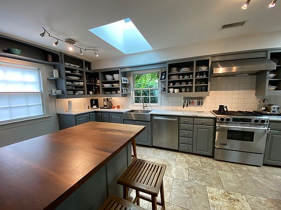 Kitchen with wood counter, gas range