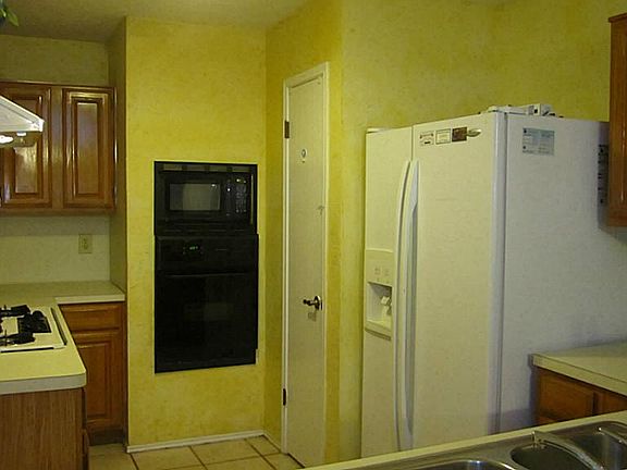 Kitchen overlook the dining room, refrigerator will stay