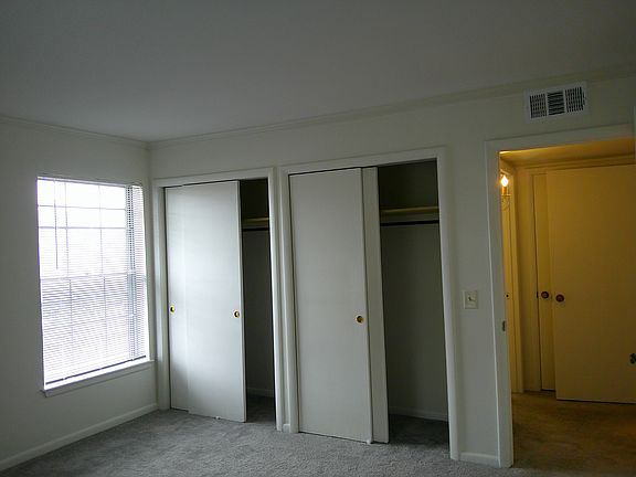 Two closets in the large bedroom.