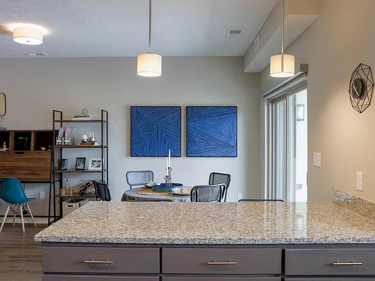 The sophisticated pendant lighting adds that perfect touch in the kitchen.
