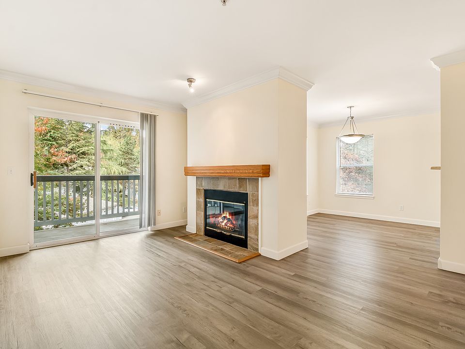 Light and bright living room with wood burning fireplace