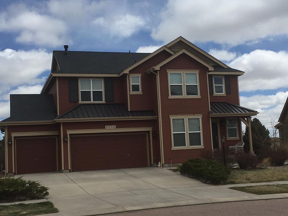 View of house from street. Located on private loop so street is safe for kids to play/ride bikes.