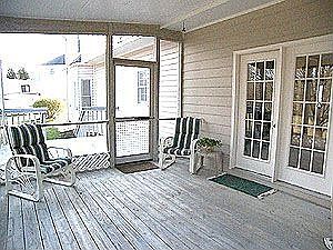 SCREENED IN PORCH LEADS TO BACK DECK