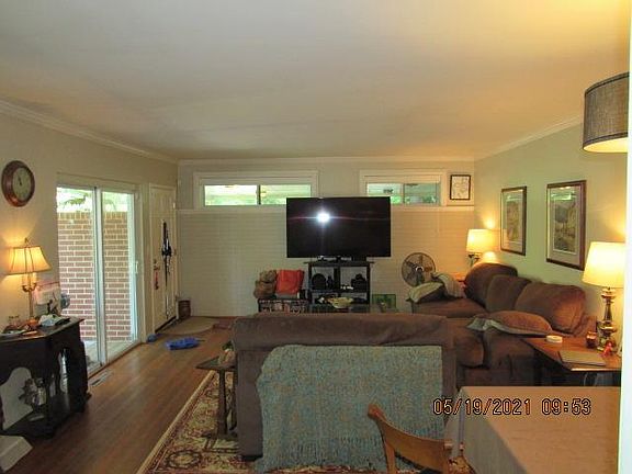 Hard wood floors throughout. Plenty of room for large couches to entertain your guests. Sliding glass door leading to your private patio.