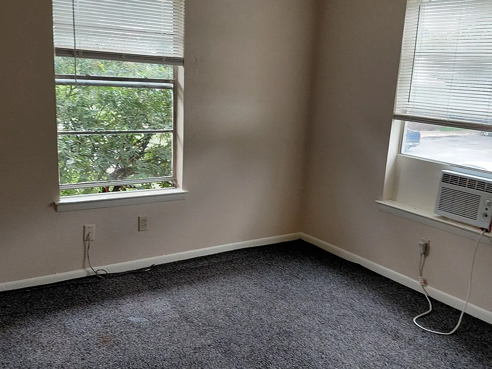 Plenty of natural light in the bedroom of this corner apartment as well