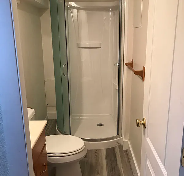 New shower surround and new vinyl floor