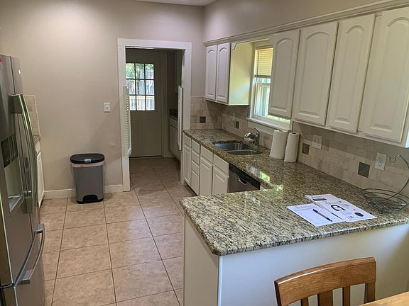 Kitchen and pantry leading to rear door